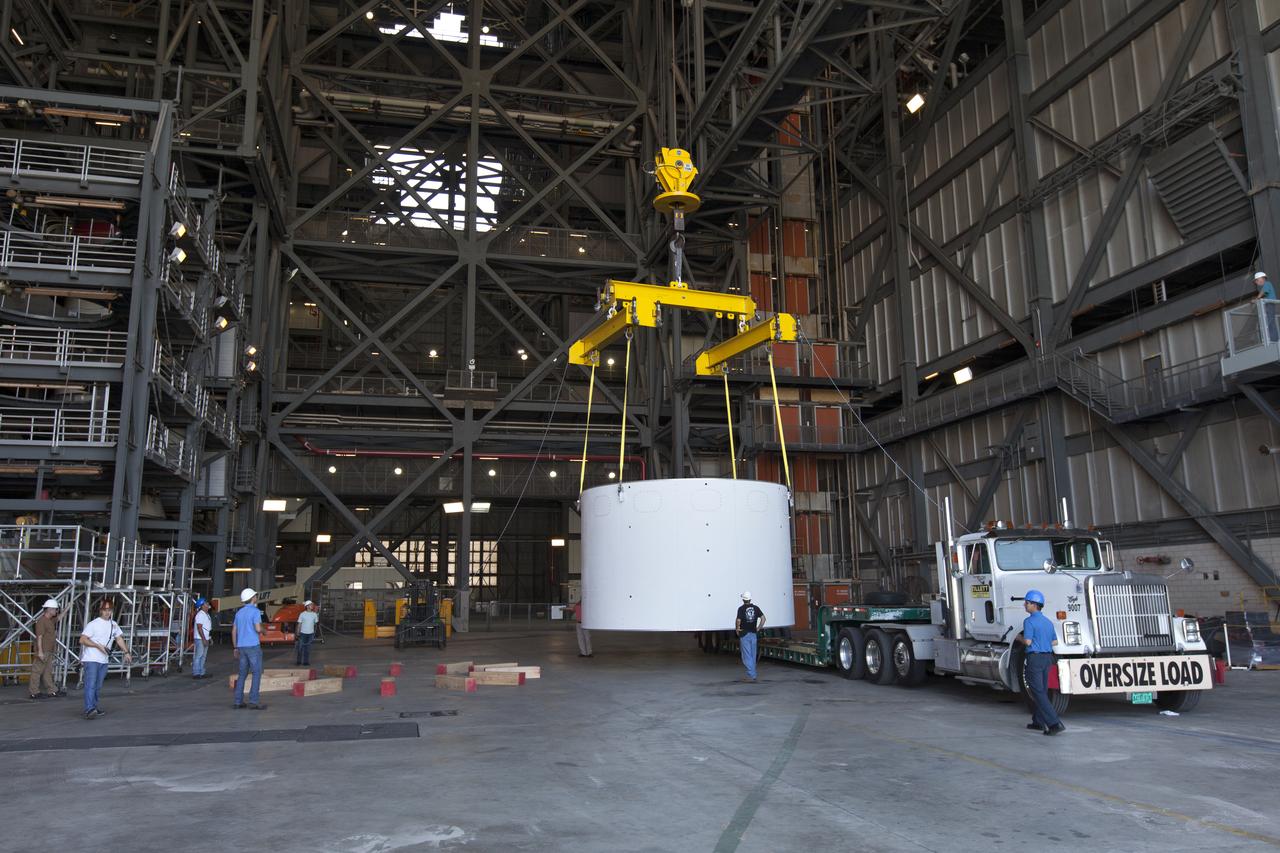 The first of three aeroshells for Orion's Launch Abort System (LAS) arrives by truck and is offloaded in High Bay 4 inside the Vehicle Assembly Building at NASA's Kennedy Space Center in Florida, on June 19, 2018. The aeroshell was shipped from EMF Inc. on nearby Merritt Island. The aeroshells will be stacked and prepared for a full-stress test of the LAS, called Ascent Abort-2 (AA-2) flight test, scheduled for April 2019. During the test, a booster will launch from Space Launch Complex 46 at Cape Canaveral Air Force Station, carrying a fully functional LAS and a 22,000-pound Orion test vehicle to an altitude of 31,000 feet and traveling at more than 1,000 miles an hour. The test will verify the LAS can steer the crew module and astronauts aboard to safety in the event of an issue with the Space Launch System (SLS) rocket when the spacecraft is under the highest aerodynamic loads it will experience during a rapid climb into space. Orion is being prepared for its first integrated uncrewed flight atop the SLS on Exploration Mission-1.