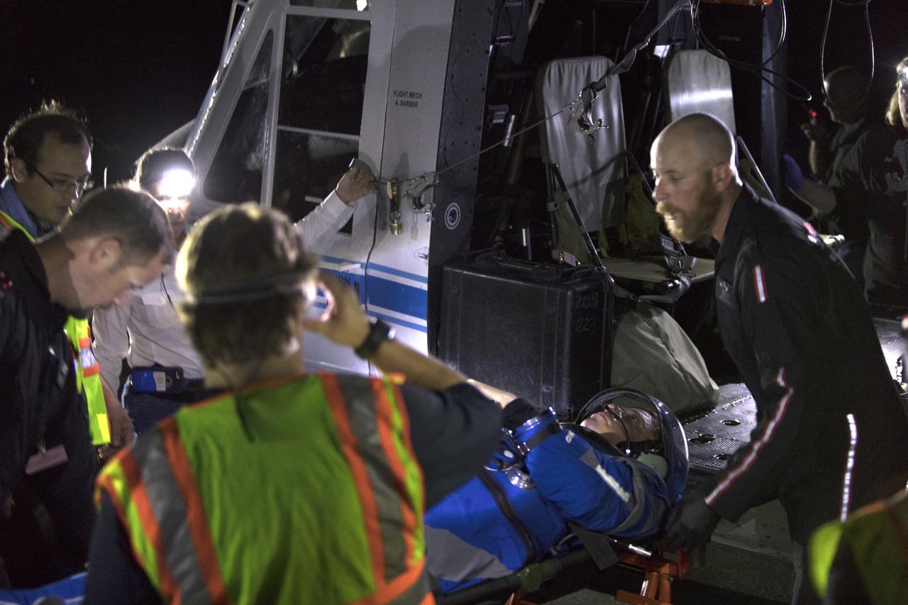 A Commercial Crew astronaut participates in a Boeing/United Launch Alliance emergency egress system demonstration at Cape Canaveral Air Force Station’s Launch Complex 41 in Florida on June 19, 2018. The system features seats attached to slide wires which would carry astronauts and ground crew more than 1,300 feet away from the crew access tower in the unlikely event of an emergency prior to liftoff.