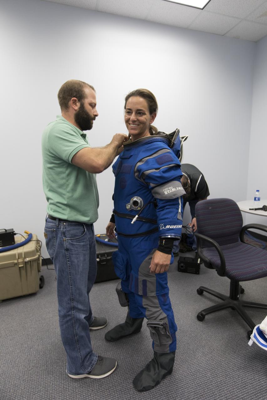 Astronaut Nicole Mann gets suited up for a Boeing/United Launch Alliance emergency egress system demonstration at Cape Canaveral Air Force Station’s Launch Complex 41 in Florida on June 19, 2018. The emergency egress system will allow for a safe evacuation in the unlikely event of an emergency on the launch pad on launch day. It can carry up to 20 people more than 1,300 feet away from the crew access tower and the launch vehicle.