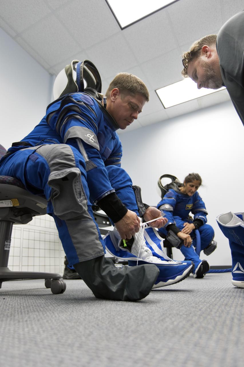 NASA astronauts Bob Behnken and Suni Williams get suited up for a Boeing/United Launch Alliance emergency egress system demonstration at Cape Canaveral Air Force Station’s Launch Complex 41 in Florida on June 19, 2018. Behnken and other astronauts tested the system, which is designed to evacuate them safely in the unlikely event of an emergency on the launch pad on launch day. The Boeing CST-100 Starliner will launch on a ULA Atlas V rocket, carrying astronauts to the International Space Station.