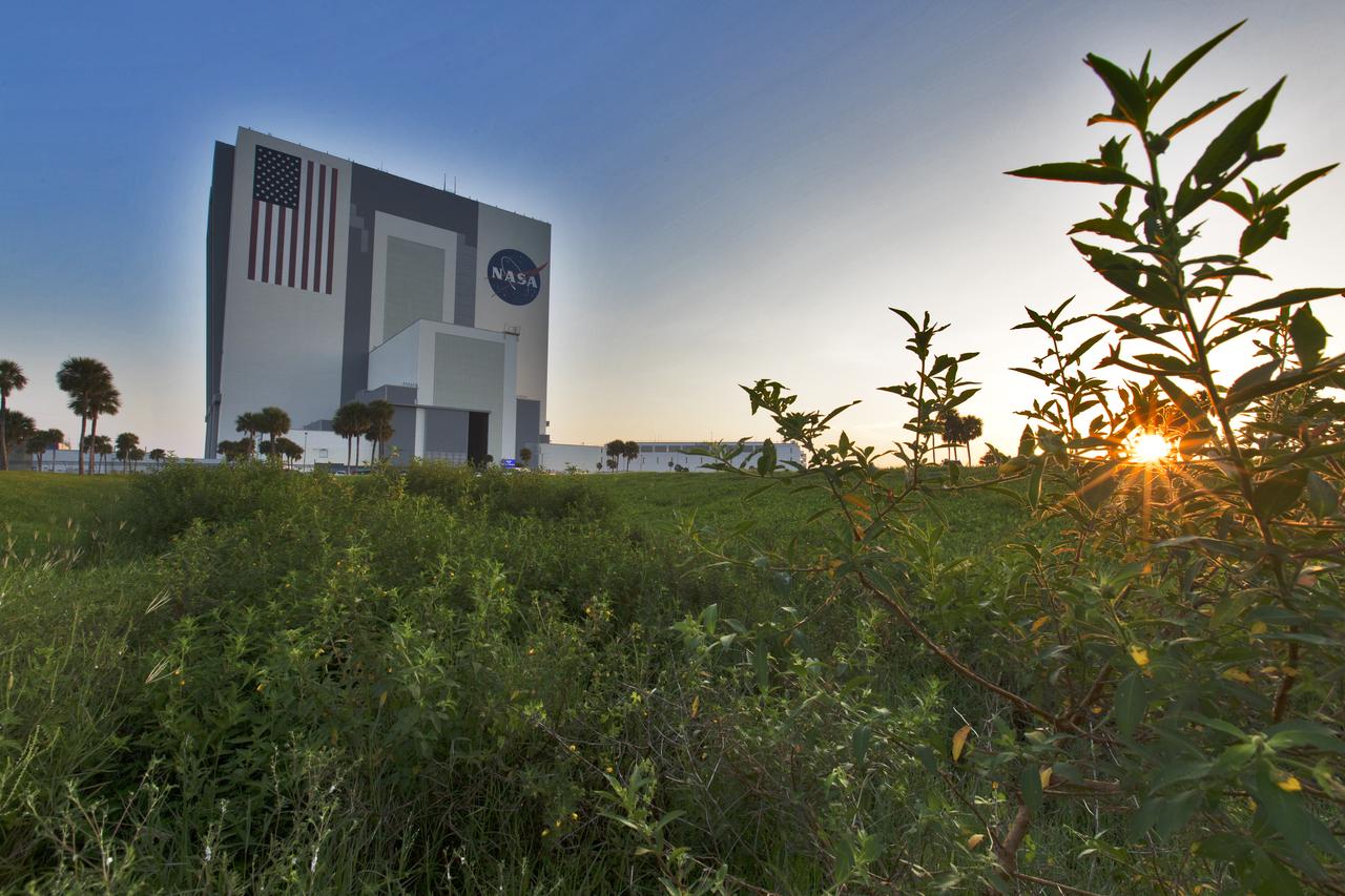 A sunrise panoramic view of the iconic Vehicle Assembly Building (VAB) at NASA's Kennedy Space Center in Florida. Ten levels of work platforms have been installed in High Bay 3 of the VAB. They will surround and provide access for service and processing of NASA's Space Launch System (SLS) rocket and Orion spacecraft. Exploration Ground Systems oversaw the upgrades and installation of the new work platforms to support the launch of the SLS and Orion on Exploration Mission-1 and deep space missions.
