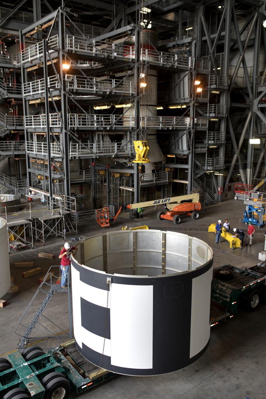 The second of three aeroshells for Orion's Launch Abort System (LAS) arrives by flatbed truck in High Bay 4 of the Vehicle Assembly Building at NASA's Kennedy Space Center in Florida, on June 26, 2018. The aeroshell was shipped from EMF Inc. on nearby Merritt Island, and will be offloaded and secured in the high bay. The aeroshells will be stacked and prepared for a full-stress test of the LAS, called Ascent Abort-2 (AA-2) flight test, scheduled for April 2019. During the test, a booster will launch from Space Launch Complex 46 at Cape Canaveral Air Force Station, carrying a fully functional LAS and a 22,000-pound Orion test vehicle to an altitude of 31,000 feet and traveling at more than 1,000 miles an hour. The test will verify the LAS can steer the crew module and astronauts aboard to safety in the event of an issue with the Space Launch System (SLS) rocket when the spacecraft is under the highest aerodynamic loads it will experience during a rapid climb into space. Orion is being prepared for its first integrated uncrewed flight atop the SLS on Exploration Mission-1.