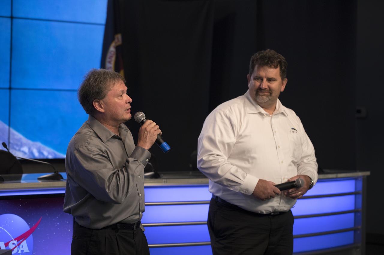 David Brady, assistant program scientist for the International Space Station Program at NASA’s Johnson Space Center left, speaks to members of the media during a briefing in the Kennedy Space Center’s Press Site auditorium. At right is Mike Roberts, deputy chief scientist, Center for the Advancement of Science in Space (CASIS). The briefing focused on research planned for launch to the International Space Station. The scientific materials and supplies will be aboard a SpaceX Dragon spacecraft scheduled for liftoff from Cape Canaveral Air Force Station's Space Launch Complex 40. The SpaceX Falcon 9 rocket will launch the company's 15th Commercial Resupply Services mission to the space station.