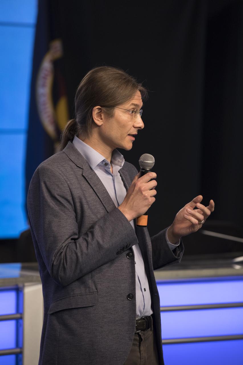 Dr. Paolo Luzzatto-Fergiz, professor, UC Santa Barbara Engineering Dept., addresses members of the media during a briefing in the Kennedy Space Center’s Press Site auditorium. The briefing focused on research planned for launch to the International Space Station. The scientific materials and supplies will be aboard a SpaceX Dragon spacecraft scheduled for liftoff from Cape Canaveral Air Force Station's Space Launch Complex 40. The SpaceX Falcon 9 rocket will launch the company's 15th Commercial Resupply Services mission to the space station.