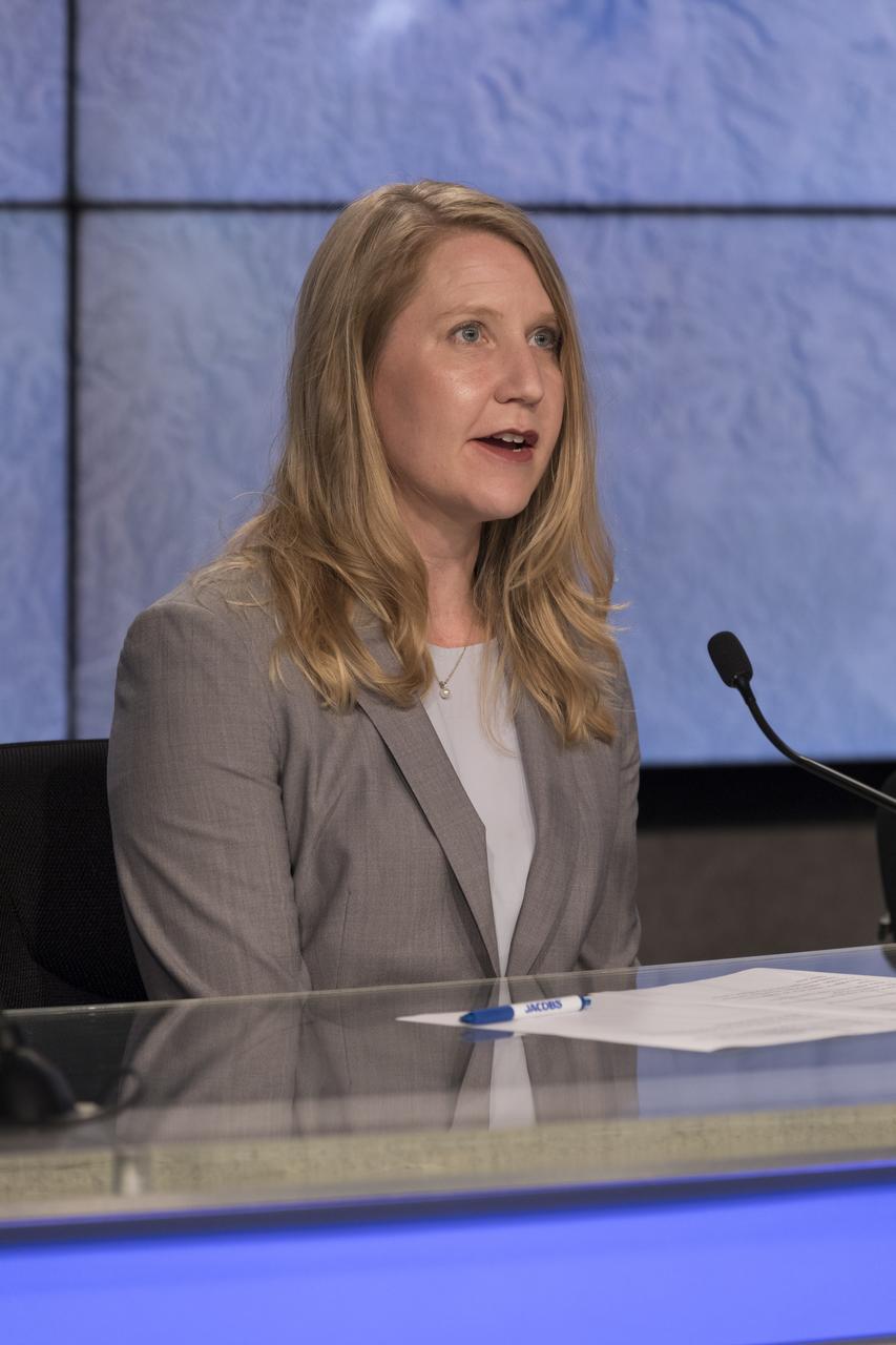 In the Kennedy Space Center’s Press Site auditorium, Stephanie Schierholz of NASA Communications, speaks to members of the media during a prelaunch news conference for the SpaceX CRS-15 Commercial Resupply Services mission to the International Space Station. A SpaceX Dragon spacecraft is scheduled to be launched from Space Launch Complex 40 at Cape Canaveral Air Force Station. The SpaceX Falcon 9 rocket will lift off on the company's 15th Commercial Resupply Services mission to the space station.