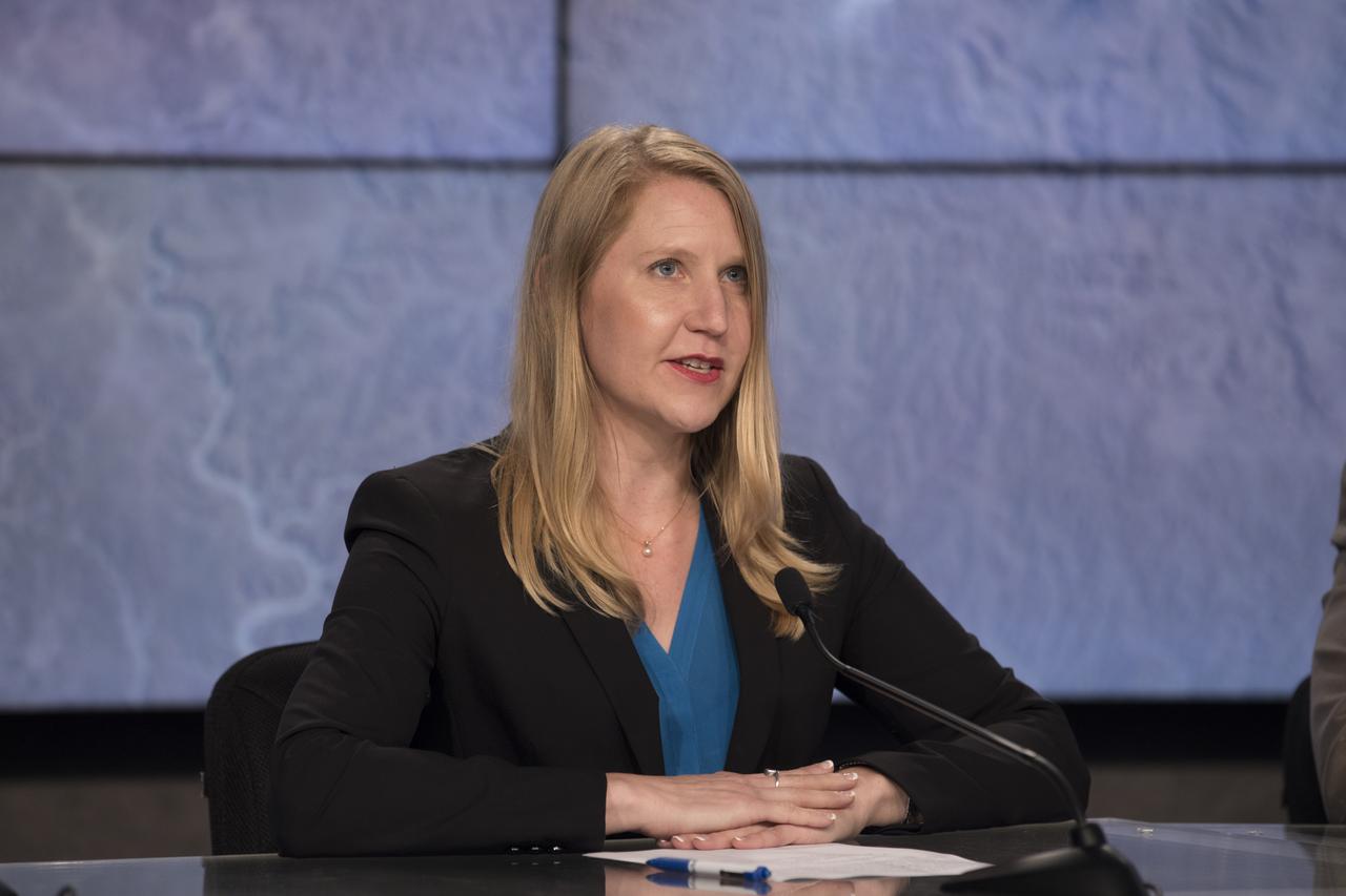 In the Press Site auditorium of NASA's Kennedy Space Center in Florida, Stephanie Schierholz of NASA Communications speaks to media at a post-launch news conference following the liftoff of SpaceX CRS-15. The flight is a commercial resupply services mission to the International Space Station. SpaceX CRS-15 lifted off atop a Falcon 9 rocket from Space Launch Complex 40 at Cape Canaveral Air Force Station on Friday, June 29, 2018, at 5:42 a.m. EDT with supplies and materials to support multiple critical science and research investigations.