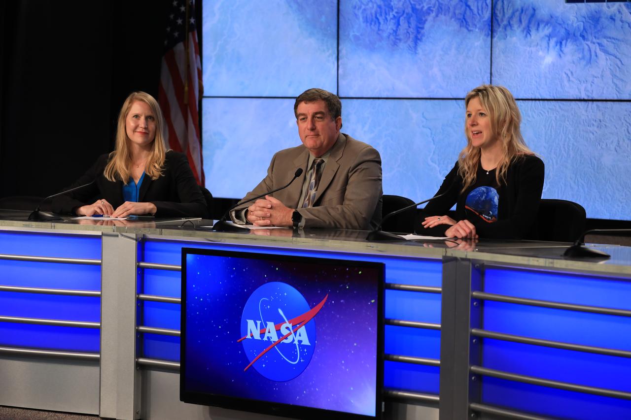 In the Press Site auditorium of NASA's Kennedy Space Center in Florida, from left, Stephanie Schierholz of NASA Communications, Kirk Shireman, manager, International Space Station Program, and Jessica Jensen, Director, Dragon Mission Management, SpaceX, speak to media at a post-launch news conference following the liftoff of SpaceX CRS-15. The flight is a commercial resupply services mission to the International Space Station. SpaceX CRS-15 lifted off atop a Falcon 9 rocket from Space Launch Complex 40 at Cape Canaveral Air Force Station on Friday, June 29, 2018, at 5:42 a.m. EDT with supplies and materials to support multiple critical science and research investigations.