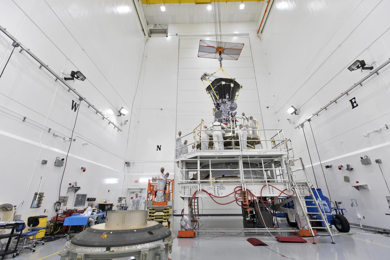 In the Astrotech processing facility in Titusville, Florida, near NASA's Kennedy Space Center, on Wednesday, July 11, 2018, technicians and engineers use a crane to move NASA's Parker Solar Probe into position for mating to its third stage, built and tested by Northrup Grumman in Chandler Arizona. The Parker Solar Probe will launch on a United Launch Alliance Delta IV Heavy rocket from Space Launch Complex 37 at Cape Canaveral Air Force Station in Florida. The mission will perform the closest-ever observations of a star when it travels through the Sun's atmosphere, called the corona. The probe will rely on measurements and imaging to revolutionize our understanding of the corona and the Sun-Earth connection.