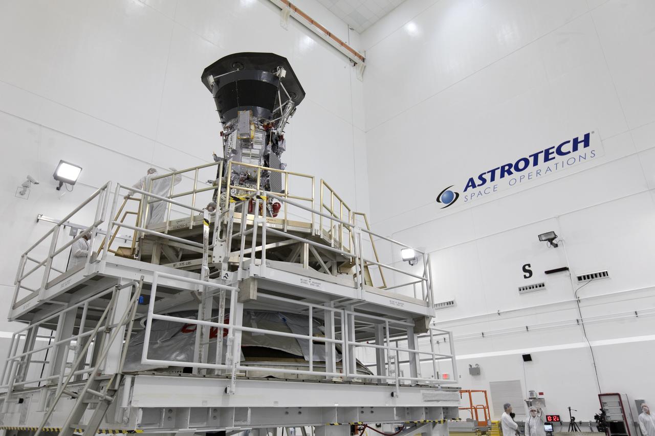 In the Astrotech processing facility in Titusville, Florida, near NASA's Kennedy Space Center, on Wednesday, July 11, 2018, technicians and engineers mate NASA's Parker Solar Probe to its third stage, built and tested by Northrup Grumman in Chandler Arizona. The Parker Solar Probe will launch on a United Launch Alliance Delta IV Heavy rocket from Space Launch Complex 37 at Cape Canaveral Air Force Station in Florida. The mission will perform the closest-ever observations of a star when it travels through the Sun's atmosphere, called the corona. The probe will rely on measurements and imaging to revolutionize our understanding of the corona and the Sun-Earth connection.