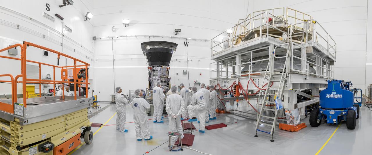 In a wide-angle view at the Astrotech processing facility in Titusville, Florida, near NASA's Kennedy Space Center, on Wednesday, July 11, 2018, technicians and engineers prepare to mate NASA's Parker Solar Probe to its third stage, built and tested by Northrup Grumman in Chandler Arizona. The Parker Solar Probe will launch on a United Launch Alliance Delta IV Heavy rocket from Space Launch Complex 37 at Cape Canaveral Air Force Station in Florida. The mission will perform the closest-ever observations of a star when it travels through the Sun's atmosphere, called the corona. The probe will rely on measurements and imaging to revolutionize our understanding of the corona and the Sun-Earth connection.