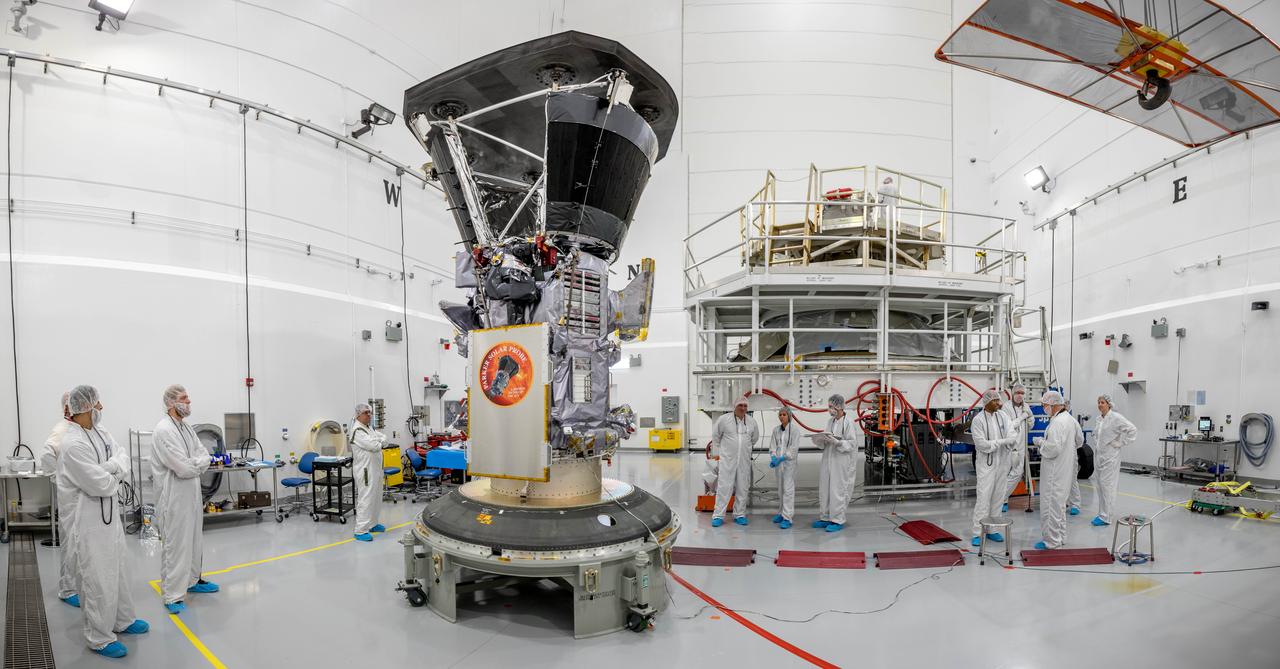 In a wide-angle view at the Astrotech processing facility in Titusville, Florida, near NASA's Kennedy Space Center, on Wednesday, July 11, 2018, technicians and engineers prepare to mate NASA's Parker Solar Probe to its third stage, built and tested by Northrup Grumman in Chandler Arizona. The Parker Solar Probe will launch on a United Launch Alliance Delta IV Heavy rocket from Space Launch Complex 37 at Cape Canaveral Air Force Station in Florida. The mission will perform the closest-ever observations of a star when it travels through the Sun's atmosphere, called the corona. The probe will rely on measurements and imaging to revolutionize our understanding of the corona and the Sun-Earth connection.