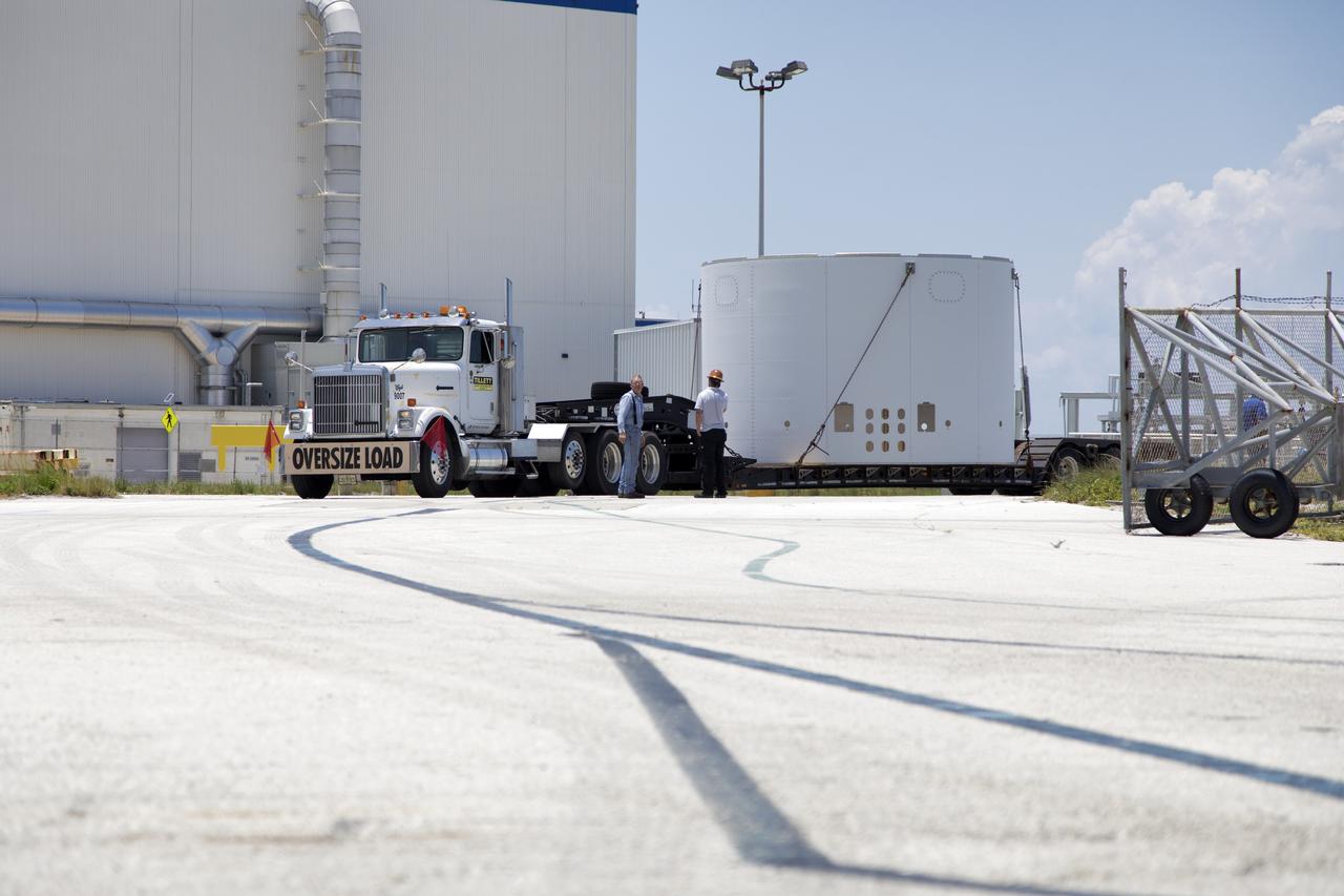 The third and final aeroshell for Orion's Launch Abort System (LAS) arrives by truck on July 12, 2018, at NASA's Kennedy Space Center in Florida. The aeroshell was shipped from EMF Inc. on nearby Merritt Island. It will be offloaded and secured in High Bay 4 of the Vehicle Assembly Building. The aeroshells will be stacked and prepared for a full-stress test of the LAS, called Ascent Abort-2 (AA-2) flight test, scheduled for April 2019. During the test, a booster will launch from Space Launch Complex 46 at Cape Canaveral Air Force Station, carrying a fully functional LAS and a 22,000-pound Orion test vehicle to an altitude of 31,000 feet and traveling at more than 1,000 miles an hour. The test will verify the LAS can steer the crew module and astronauts aboard to safety in the event of an issue with the Space Launch System (SLS) rocket when the spacecraft is under the highest aerodynamic loads it will experience during a rapid climb into space. Orion is being prepared for its first integrated uncrewed flight atop the SLS on Exploration Mission-1.