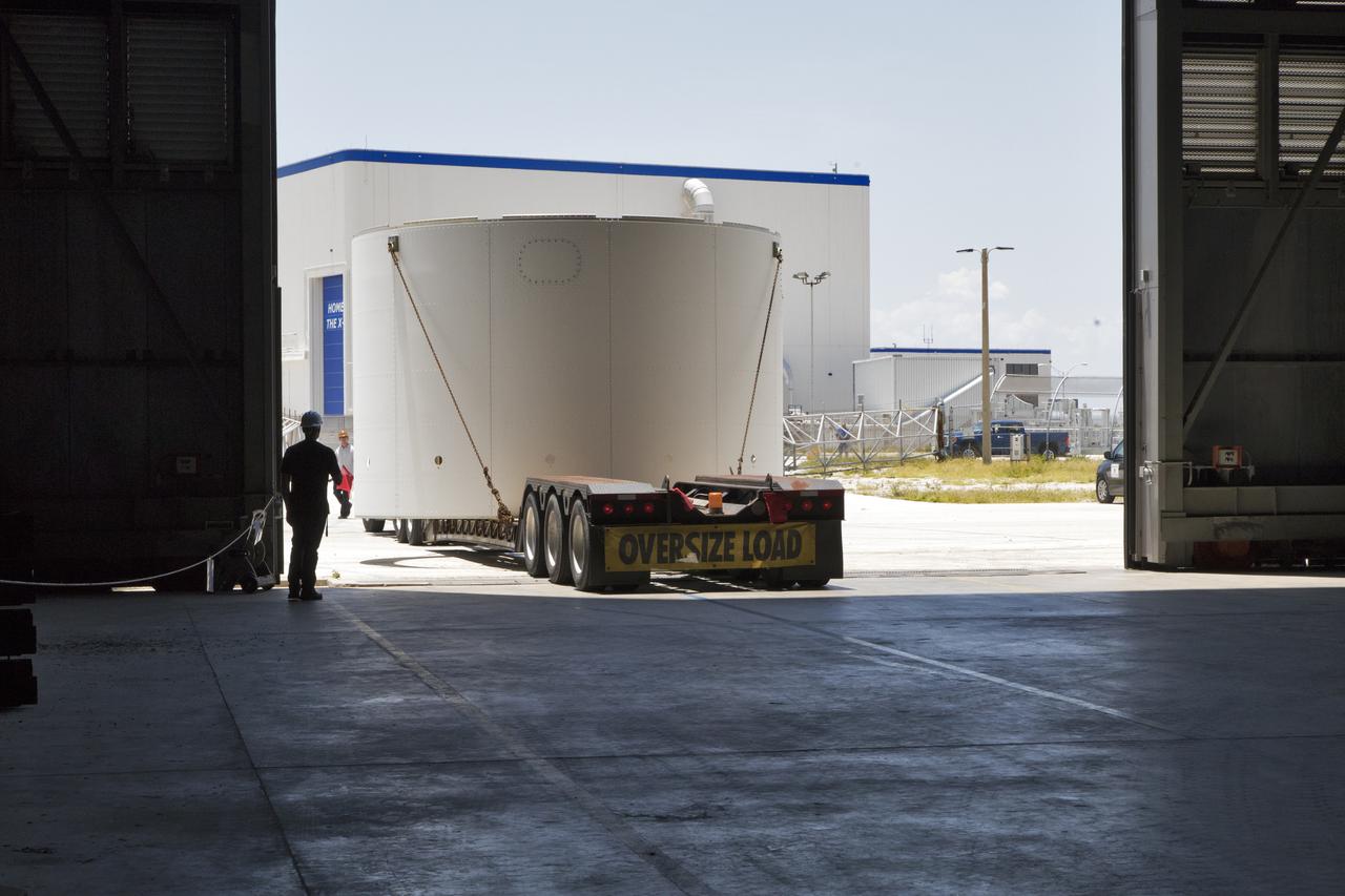 The third and final aeroshell for Orion's Launch Abort System (LAS) arrives by truck at the Vehicle Assembly Building on July 12, 2018, at NASA's Kennedy Space Center in Florida. The aeroshell was shipped from EMF Inc. on nearby Merritt Island. It will be offloaded and secured in High Bay 4. The aeroshells will be stacked and prepared for a full-stress test of the LAS, called Ascent Abort-2 (AA-2) flight test, scheduled for April 2019. During the test, a booster will launch from Space Launch Complex 46 at Cape Canaveral Air Force Station, carrying a fully functional LAS and a 22,000-pound Orion test vehicle to an altitude of 31,000 feet and traveling at more than 1,000 miles an hour. The test will verify the LAS can steer the crew module and astronauts aboard to safety in the event of an issue with the Space Launch System (SLS) rocket when the spacecraft is under the highest aerodynamic loads it will experience during a rapid climb into space. Orion is being prepared for its first integrated uncrewed flight atop the SLS on Exploration Mission-1.