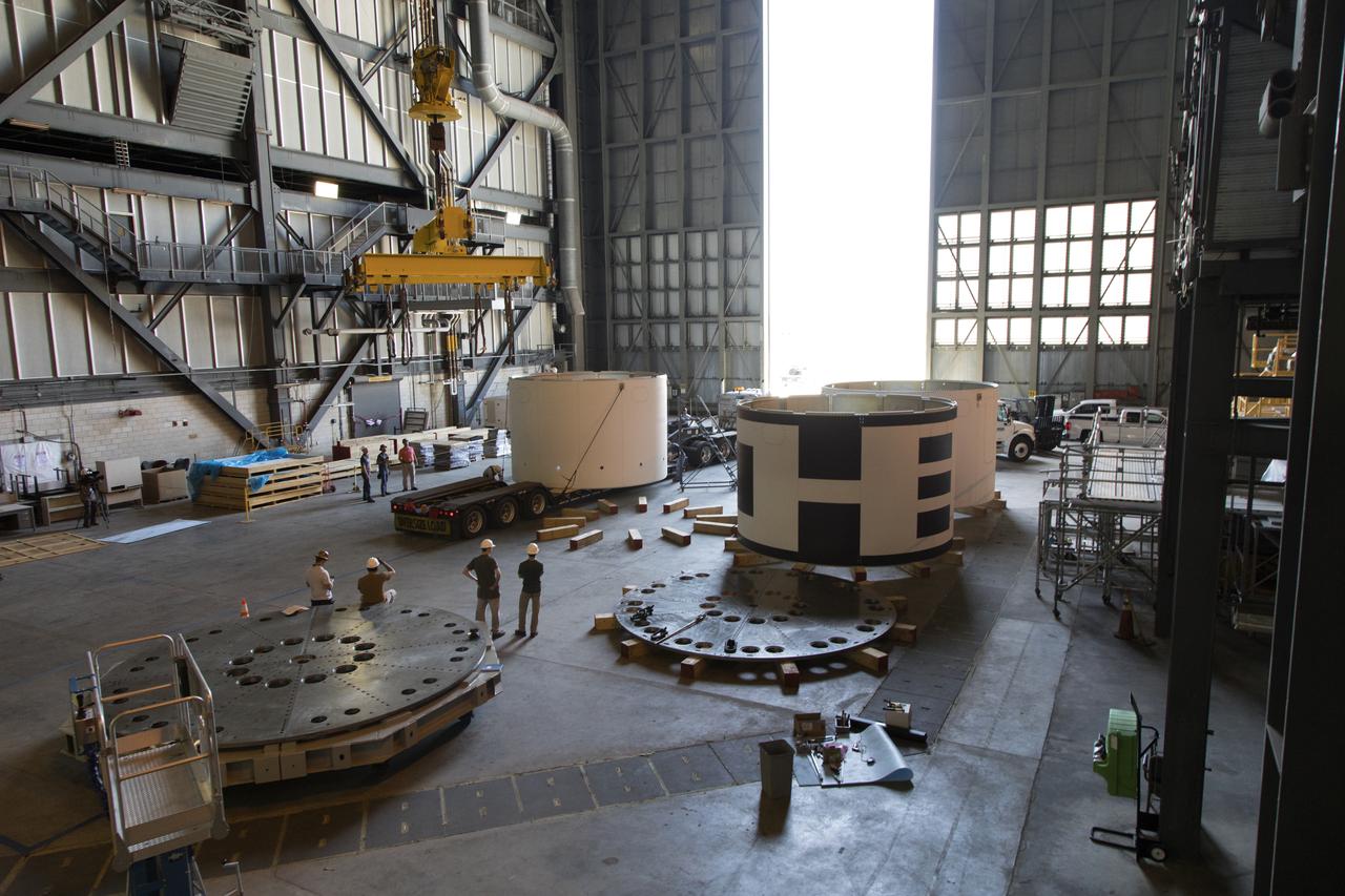 The third and final aeroshells for Orion's Launch Abort System (LAS) arrives by flatbed truck in High Bay 4 of the Vehicle Assembly Building on July 12, 2018, at NASA's Kennedy Space Center in Florida. The aeroshell was shipped from EMF Inc. on nearby Merritt Island. It will be offloaded and secured in the high bay. The aeroshells will be stacked and prepared for a full-stress test of the LAS, called Ascent Abort-2 (AA-2) flight test, scheduled for April 2019. During the test, a booster will launch from Space Launch Complex 46 at Cape Canaveral Air Force Station, carrying a fully functional LAS and a 22,000-pound Orion test vehicle to an altitude of 31,000 feet and traveling at more than 1,000 miles an hour. The test will verify the LAS can steer the crew module and astronauts aboard to safety in the event of an issue with the Space Launch System (SLS) rocket when the spacecraft is under the highest aerodynamic loads it will experience during a rapid climb into space. Orion is being prepared for its first integrated uncrewed flight atop the SLS on Exploration Mission-1.