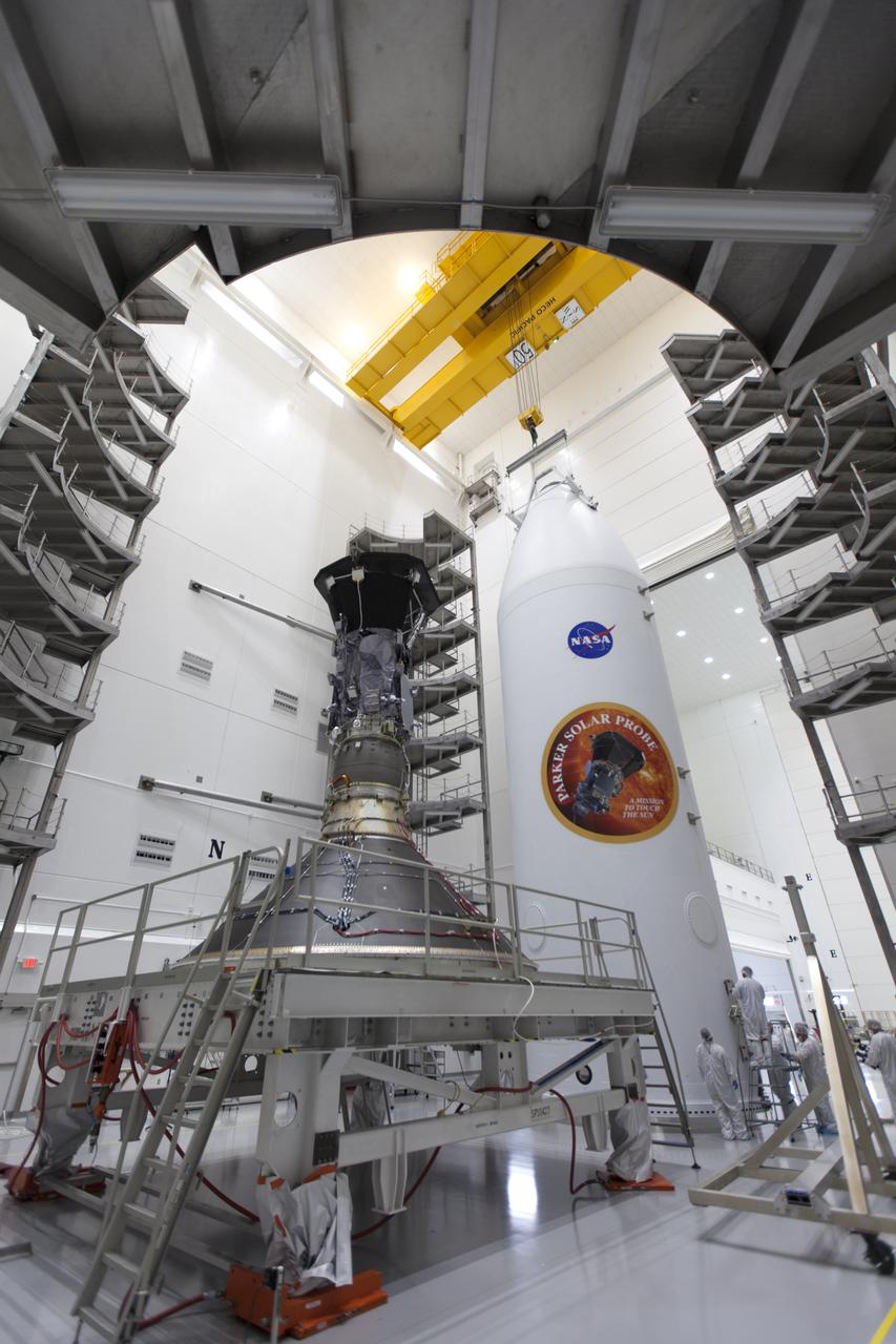 In the Astrotech processing facility in Titusville, Florida, near NASA's Kennedy Space Center, on Monday, July 16, 2018, NASA's Parker Solar Probe is prepared for encapsulation in its payload fairing. The spacecraft is mated to its third stage, built and tested by Northrup Grumman in Chandler, Arizona. The Parker Solar Probe will launch on a United Launch Alliance Delta IV Heavy rocket from Space Launch Complex 37 at Cape Canaveral Air Force Station in Florida. The mission will perform the closest-ever observations of a star when it travels through the Sun's atmosphere, called the corona. The probe will rely on measurements and imaging to revolutionize our understanding of the corona and the Sun-Earth connection