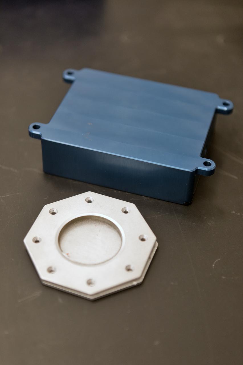 In the Electrostatics and Surface Physics Laboratory at NASA's Kennedy Space Center in Florida, scientists are developing the Electrostatic Dust Shield to help mitigate the problem of dust on equipment, astronauts' space suits and helmet visors of astronauts exploring the Moon or Mars. The hardware in display on Thursday, July 19, 2018, is slated for testing the Electrostatic Dust Shield aboard International Space Station in the spring of 2019 to verify the effects of the space environment.