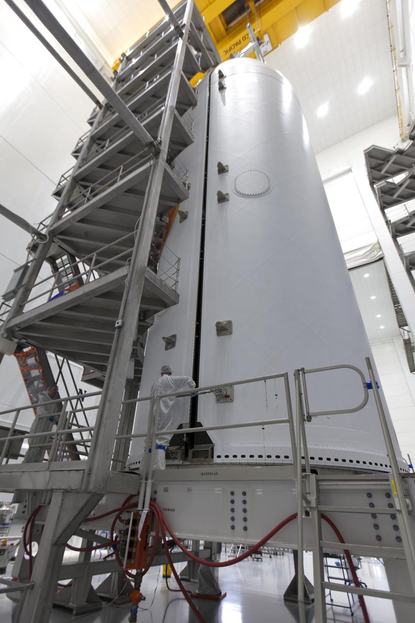 In the Astrotech processing facility in Titusville, Florida, near NASA's Kennedy Space Center, on Thursday, July 19, 2018, NASA's Parker Solar Probe has been encapsulated in its payload fairing. The spacecraft is mated to its third stage, built and tested by Northrup Grumman in Chandler, Arizona. The Parker Solar Probe will launch on a United Launch Alliance Delta IV Heavy rocket from Space Launch Complex 37 at Cape Canaveral Air Force Station in Florida. The mission will perform the closest-ever observations of a star when it travels through the Sun's atmosphere, called the corona. The probe will rely on measurements and imaging to revolutionize our understanding of the corona and the Sun-Earth connection.