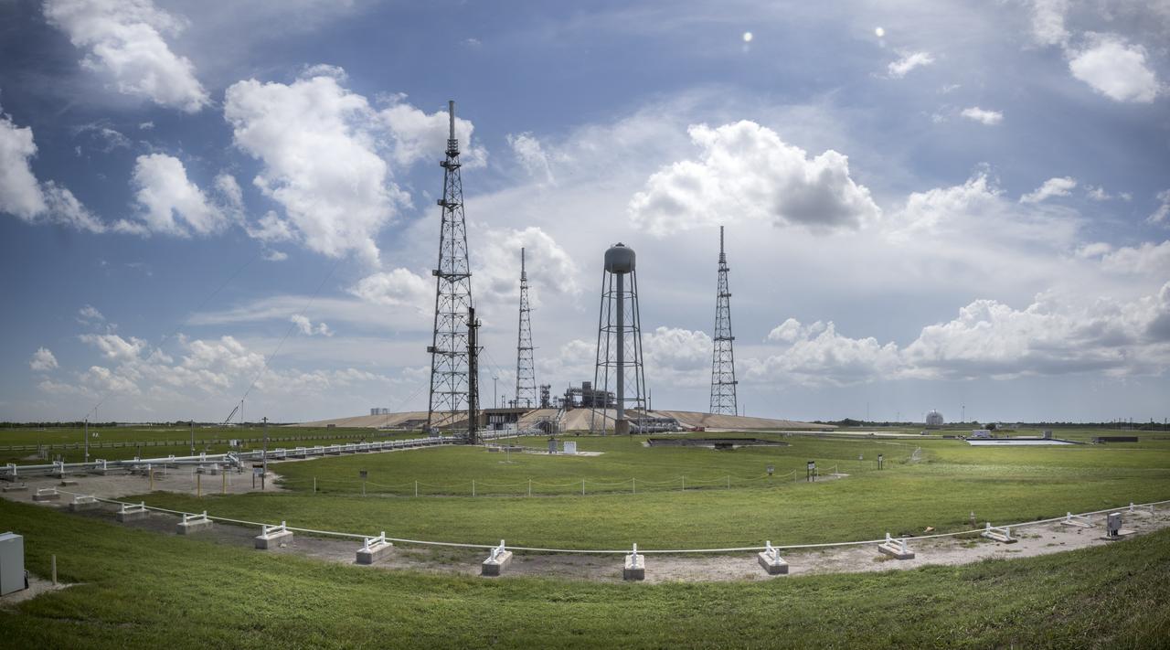 A full view of Launch Pad 39B at NASA's Kennedy Space Center in Florida on July 26, 2018. The launch pad has undergone upgrades and modifications to accommodate NASA's Space Launch System and Orion spacecraft for Exploration Mission-1 and other deep space missions. New heat-resistant bricks have been installed on the walls and a new flame deflector is in place. In view are the three lightning protection system towers and water tank. The clean pad concept is designed to support NASA and commercial launch providers at the multi-user spaceport. 