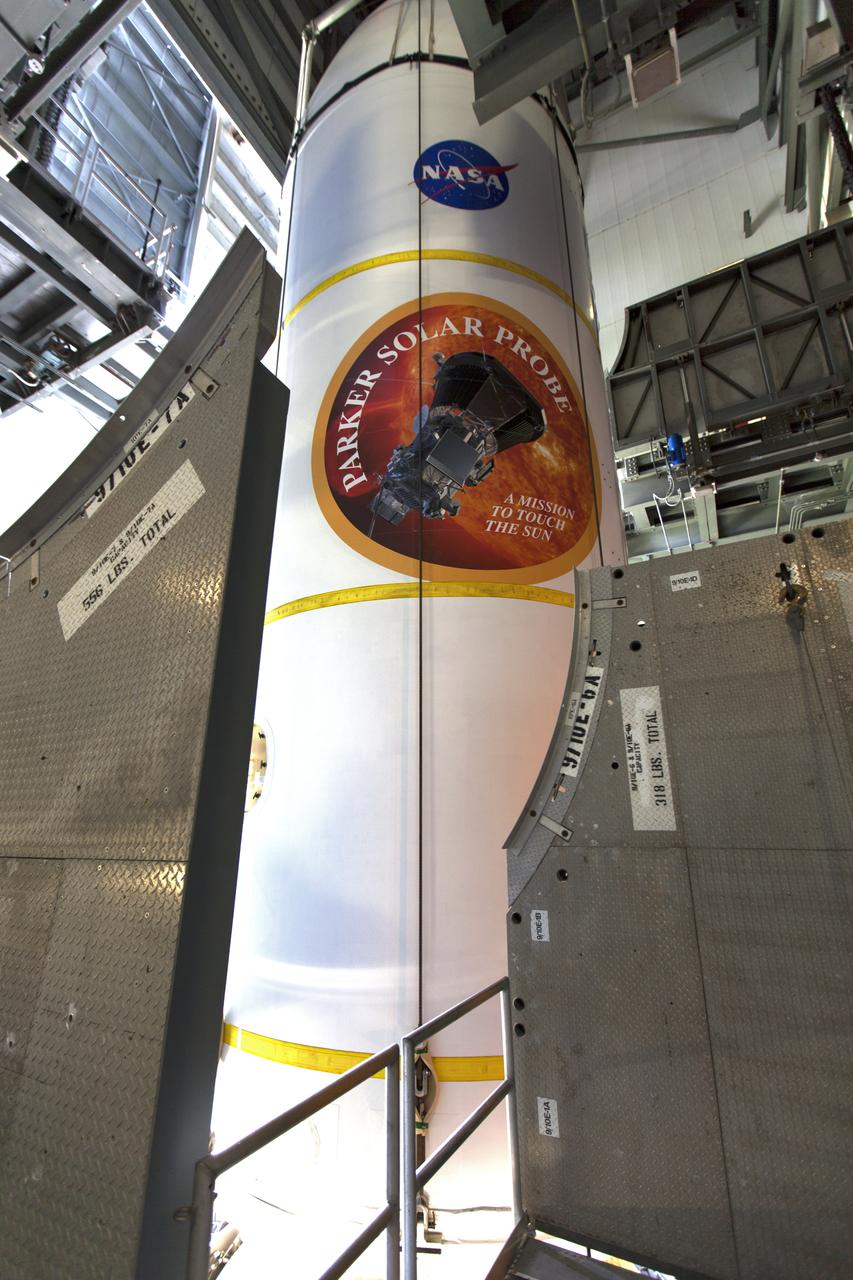 Encapsulated in its payload fairing, NASA's Parker Solar Probe is lifted by a crane for mating to a United Launch Alliance Delta IV Heavy rocket at Cape Canaveral Air Force Station's Space Launch Complex 37 on Tuesday, July 31, 2018. The Parker Solar Probe is being prepared for a mission to perform the closest-ever observations of a star when it travels through the Sun's atmosphere, called the corona. The probe will rely on measurements and imaging to revolutionize our understanding of the corona and the Sun-Earth connection.