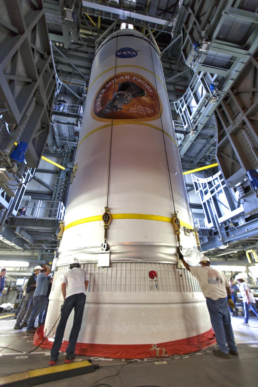 Encapsulated in its payload fairing, NASA's Parker Solar Probe is mated to a United Launch Alliance Delta IV Heavy rocket at Cape Canaveral Air Force Station's Space Launch Complex 37 on Tuesday, July 31, 2018. The Parker Solar Probe is being prepared for a mission to perform the closest-ever observations of a star when it travels through the Sun's atmosphere, called the corona. The probe will rely on measurements and imaging to revolutionize our understanding of the corona and the Sun-Earth connection.