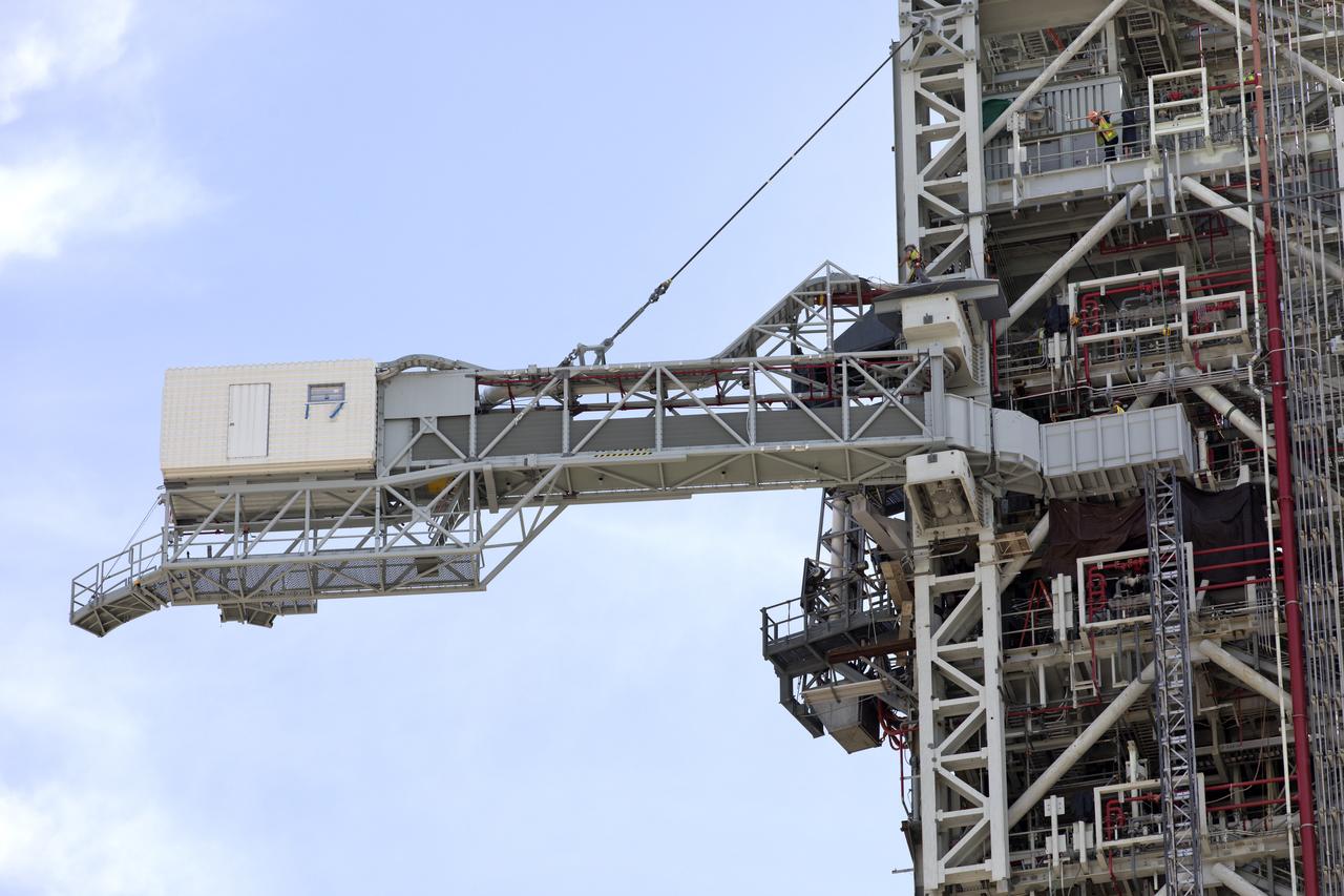 Technicians and engineers with Exploration Ground Systems at the NASA's Kennedy Space Center in Florida recently tested the Crew Access Arm (CAA) that was added on the mobile launcher being prepared to support the agency’s Orion spacecraft and Space Launch System rocket. The crucial test confirmed the functionality and integrity of the CAA. The CAA is designed to rotate from its retracted position and line up with Orion's crew hatch. The arm will provide entry and emergency egress for astronauts and technicians into and out of the Orion spacecraft.