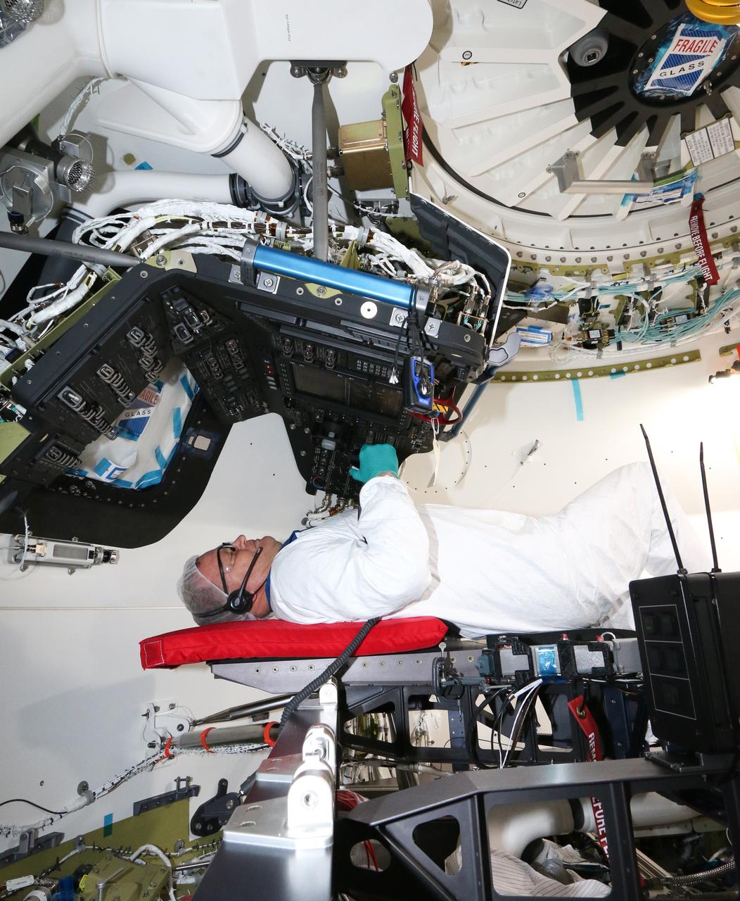 Inside Boeing's Commercial Crew and Cargo Processing Facility at NASA's Kennedy Space Center in Florida, NASA astronaut Eric Boe participates in the first full-up acceptance test of Boeing's CST-100 Starliner, on Aug. 22, 2018. The Starliner will be the first to fly astronauts on the company's Crew Flight Test (CFT), following environmental testing in El Segundo, California. Acceptance testing is a critical part of the spacecraft build progression. Generally, it gives the crew module a clean bill of health that it is built correctly, performs to expectations and is ready to fly.