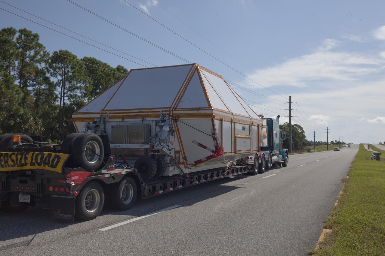 The Orion crew module pressure vessel for Exploration Mission-2 arrives at NASA's Kennedy Space Center in Florida on Aug. 24, 2018. The pressure vessel was transported in its Crew Module Transportation Fixture by super-wide transport truck from Michoud Assembly Facility near New Orleans. The pressure vessel is Orion's primary structure that holds the pressurized atmosphere astronauts will breathe and work in while in the vacuum of deep space. It will be moved into the Neil Armstrong Operations and Checkout Building high bay, where it will be secured on a precision alignment tool to begin preparing it for flight.