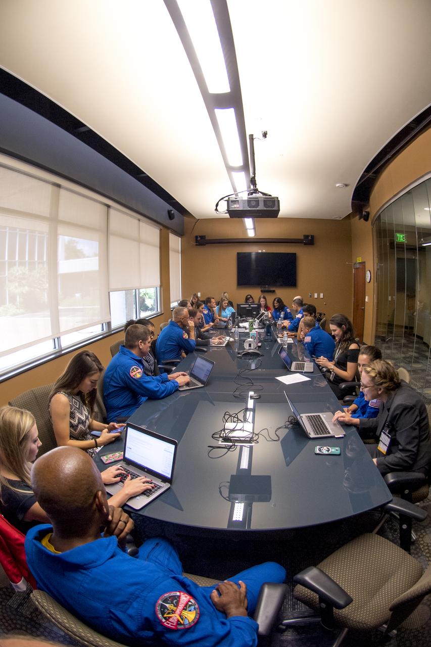 Commercial crew astronauts Eric Boe, Josh Cassada, Chris Ferguson, Nicole Mann, Suni Williams, Bob Behnken, Victor Glover, Mike Hopkins and Doug Hurley interact with employees at Johnson Space Center shortly after their commercial spaceflight assignments were announced. Boe, Ferguson and Mann will fly on Boeing’s CST-100 Starliner in the company’s upcoming Crew Flight Test to the International Space Station, while Cassada and Williams are assigned to Starliner’s first operational mission to the space station. Behnken and Hurley will fly on SpaceX’s Crew Dragon in the company’s Demo-2 flight test to the space station, while Glover and Hopkins are assigned to Crew Dragon’s first operational mission to station.