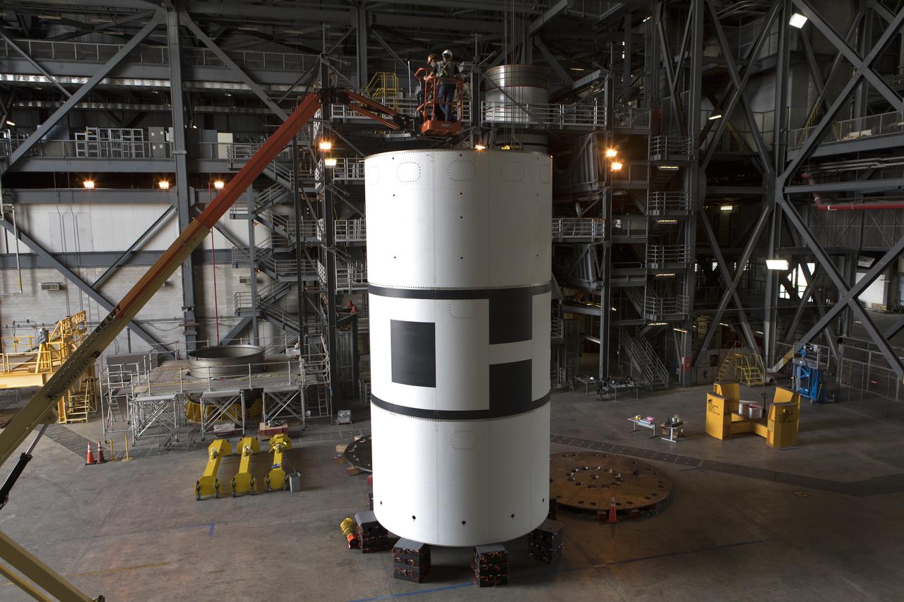 The aeroshells for Orion's Launch Abort System (LAS) are being stacked in High Bay 4 of the Vehicle Assembly Building on Aug. 3, 2018, at NASA's Kennedy Space Center in Florida. The aeroshells are being prepared for a full-stress test of the LAS, called Ascent Abort-2 (AA-2) flight test, scheduled for April 2019. During the test, a booster will launch from Space Launch Complex 46 at Cape Canaveral Air Force Station, carrying a fully functional LAS and a 22,000-pound Orion test vehicle to an altitude of 31,000 feet and traveling at more than 1,000 miles an hour. The test will verify the LAS can steer the crew module and astronauts aboard to safety in the event of an issue with the Space Launch System (SLS) rocket when the spacecraft is under the highest aerodynamic loads it will experience during a rapid climb into space. Orion is being prepared for its first integrated uncrewed flight atop the SLS on Exploration Mission-1.