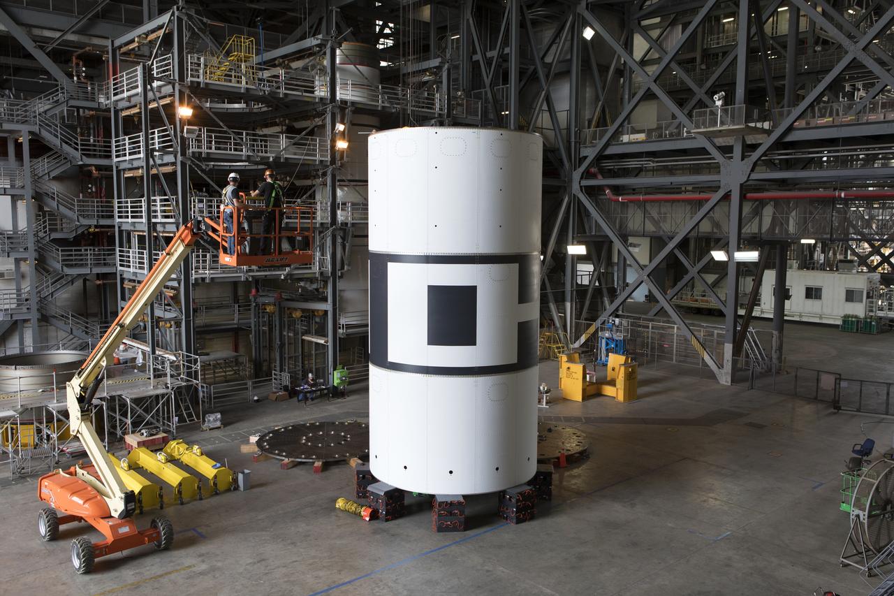 The aeroshells for Orion's Launch Abort System (LAS) are stacked in High Bay 4 of the Vehicle Assembly Building on Aug. 3, 2018, at NASA's Kennedy Space Center in Florida. The aeroshells are being prepared for a full-stress test of the LAS, called Ascent Abort-2 (AA-2) flight test, scheduled for April 2019. During the test, a booster will launch from Space Launch Complex 46 at Cape Canaveral Air Force Station, carrying a fully functional LAS and a 22,000-pound Orion test vehicle to an altitude of 31,000 feet and traveling at more than 1,000 miles an hour. The test will verify the LAS can steer the crew module and astronauts aboard to safety in the event of an issue with the Space Launch System (SLS) rocket when the spacecraft is under the highest aerodynamic loads it will experience during a rapid climb into space. Orion is being prepared for its first integrated uncrewed flight atop the SLS on Exploration Mission-1.