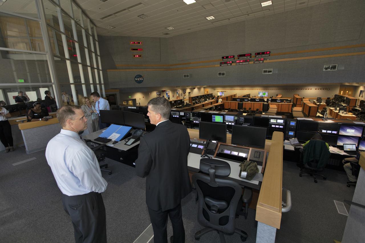 NASA Administrator Jim Bridenstine (left) is briefed by Jeremy Graeber, chief of Test, Launch and Recovery Operations during a tour of the Firing Room of the Launch Control Center at NASA's Kennedy Space Center. Bridenstine made his first official visit to the Florida spaceport on Aug. 6 and 7, 2018.