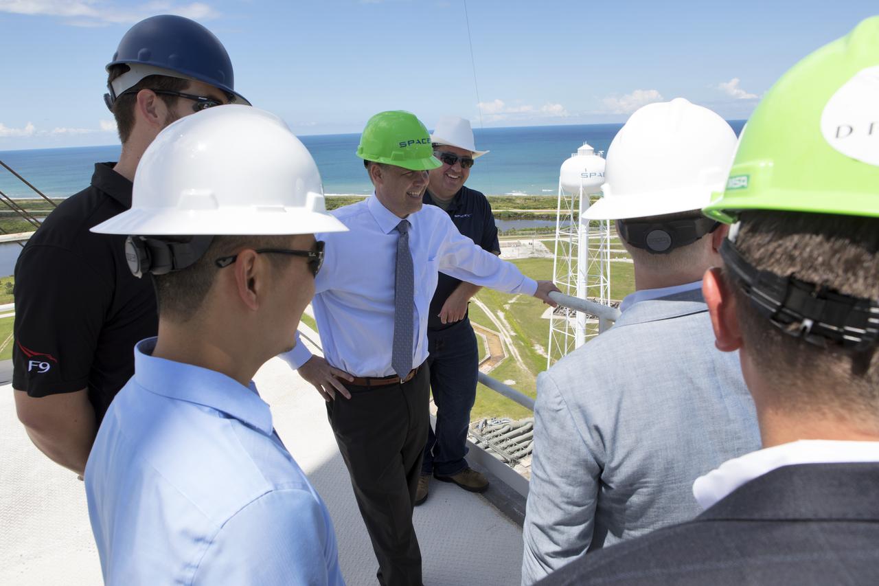 NASA Administrator Jim Bridenstine, center, in the green safety helmet, tours SpaceX Launch Complex 39A, on Aug. 8, 2018, at the agency's Kennedy Space Center in Florida. Bridenstine received updates on SpaceX accomplishments for NASA's Commercial Crew Program.