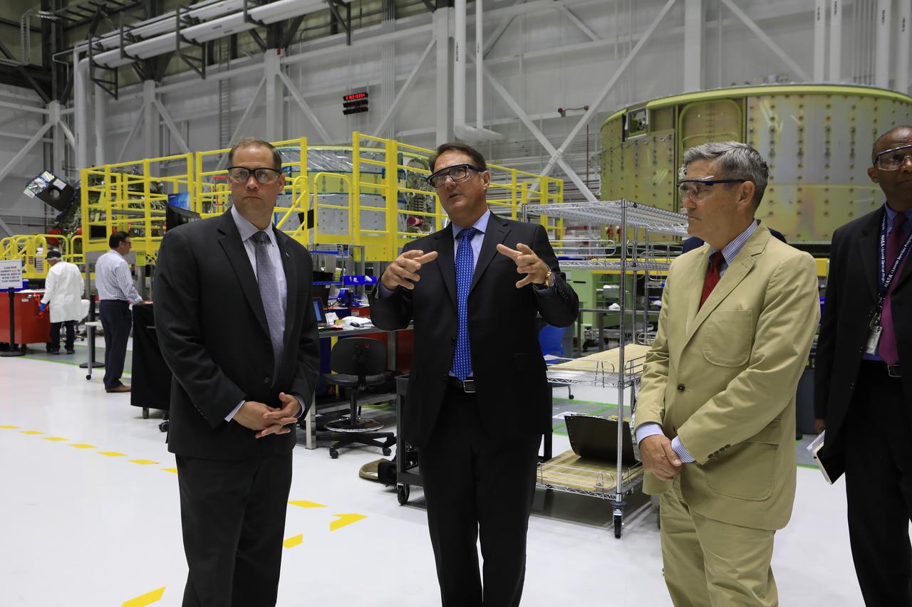 In the Commercial Crew and Cargo Processing Facility at NASA's Kennedy Space Center, agency Administrator Jim Bridenstine (right) is briefed by John Mulholland, vice president and manager of Boeing's CST-100 Starliner Program. The C3PF is the production and processing home of Boeing’s Starliner spacecraft. Bridenstine made his first official visit to NASA's Kennedy Space Center on Aug. 6 and 7, 2018.