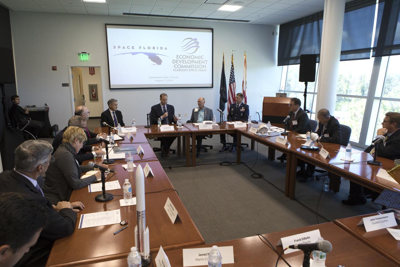 NASA Administrator Jim Bridenstine, seated at the far table, center, participates in an Economic Development Commission roundtable discussion hosted by Space Florida at the Space Life Sciences Laboratory on Aug. 7, 2018, near NASA's Kennedy Space Center in Florida. Seated at left is Kennedy Center Director Bob Cabana. Seated at right is U.S. Rep. Bill Posey, and Brigadier General Wayne Monteith, commander, 45th Space Wing, and director, Eastern Range, Patrick Air Force Base in Florida. The administrator also toured Kennedy facilities and received updates on various center accomplishments.