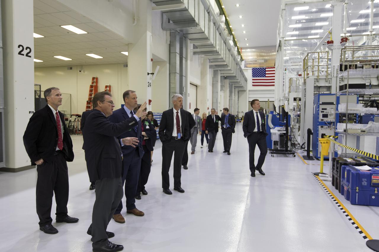 NASA Administrator Jim Bridenstine, third from left, is briefed by Jules Schneider, left, director of Orion operations for Lockheed Martin, during a tour of Kennedy Space Center’s Neil Armstrong Operations and Checkout Building on Tuesday, Aug. 7, 2018. It was Bridenstine’s first official visit to the Florida spaceport.