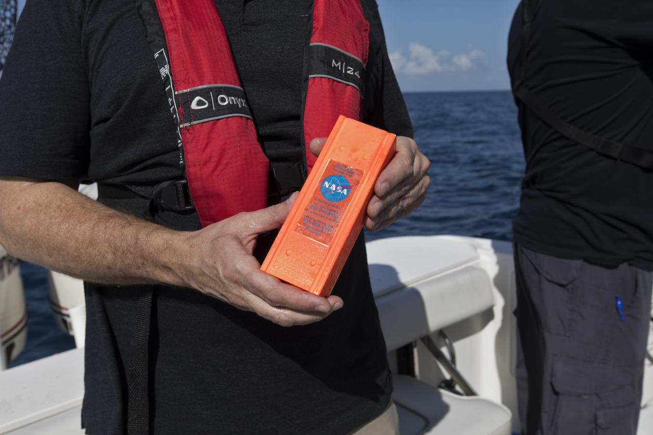 Members of the Ascent Abort-2 (AA-2) Flight Test team perform a drop test of data recording devices about 10 miles off the coast of NASA’s Kennedy Space Center in Florida on Wednesday, Aug. 8, 2018. These devices, called Ejectable Data Recorders (EDRs), were tossed out of a helicopter hovering 5,000 feet over the Atlantic Ocean and retrieved by recovery boats. The AA-2 Flight Test team is evaluating how the systems in the devices react to elements encountered from the sky to the ocean. In April 2019, the EDRs will eject from the Orion test article during a scheduled test of the spacecraft’s Launch Abort System (LAS).