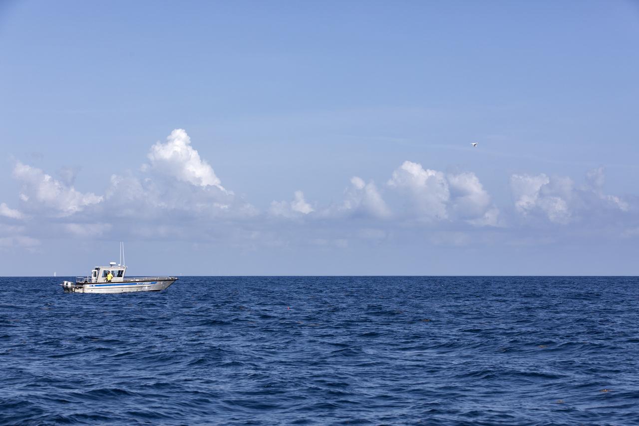Members of the Ascent Abort-2 (AA-2) Flight Test team perform a drop test of data recording devices about 10 miles off the coast of NASA’s Kennedy Space Center in Florida on Wednesday, Aug. 8, 2018. These devices, called Ejectable Data Recorders (EDRs), were tossed out of a helicopter hovering 5,000 feet over the Atlantic Ocean and retrieved by recovery boats. The AA-2 Flight Test team is evaluating how the systems in the devices react to elements encountered from the sky to the ocean. In April 2019, the EDRs will eject from the Orion test article during a scheduled test of the spacecraft’s Launch Abort System (LAS).