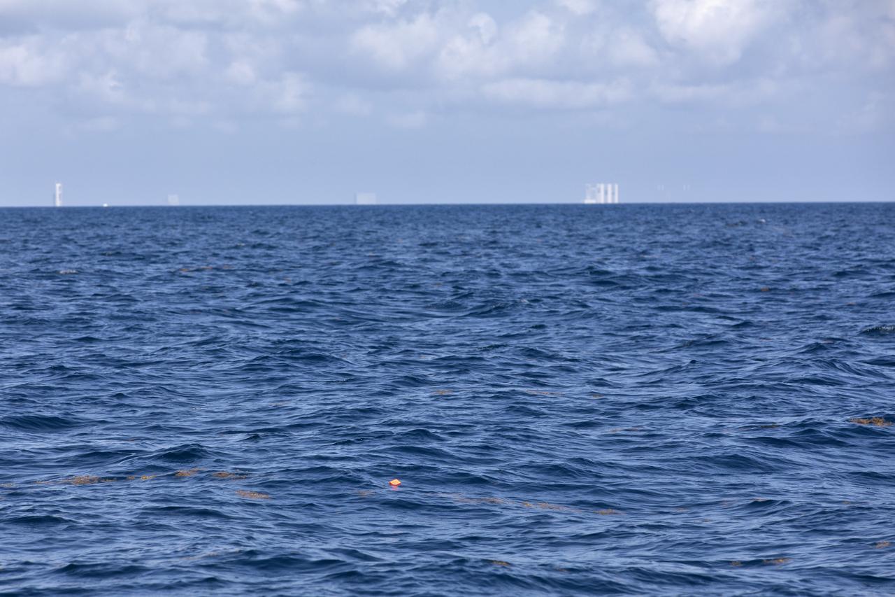 Members of the Ascent Abort-2 (AA-2) Flight Test team perform a drop test of data recording devices about 10 miles off the coast of NASA’s Kennedy Space Center in Florida on Wednesday, Aug. 8, 2018. These devices, called Ejectable Data Recorders (EDRs), were tossed out of a helicopter hovering 5,000 feet over the Atlantic Ocean and retrieved by recovery boats. The AA-2 Flight Test team is evaluating how the systems in the devices react to elements encountered from the sky to the ocean. In April 2019, the EDRs will eject from the Orion test article during a scheduled test of the spacecraft’s Launch Abort System (LAS).