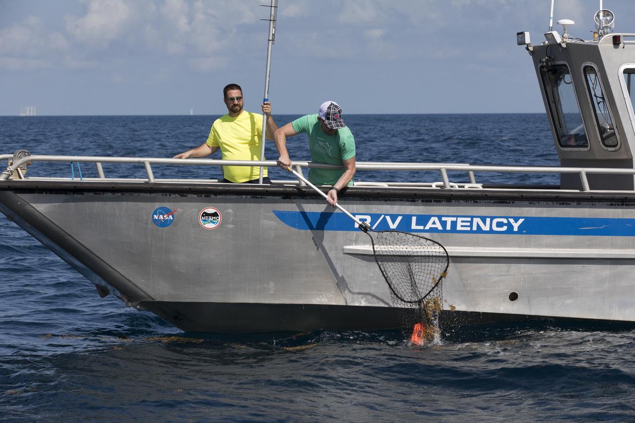 Members of the Ascent Abort-2 (AA-2) Flight Test team perform a drop test of data recording devices about 10 miles off the coast of NASA’s Kennedy Space Center in Florida on Wednesday, Aug. 8, 2018. These devices, called Ejectable Data Recorders (EDRs), were tossed out of a helicopter hovering 5,000 feet over the Atlantic Ocean and retrieved by recovery boats. The AA-2 Flight Test team is evaluating how the systems in the devices react to elements encountered from the sky to the ocean. In April 2019, the EDRs will eject from the Orion test article during a scheduled test of the spacecraft’s Launch Abort System (LAS).