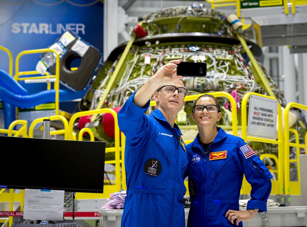 Commercial Crew astronauts Chris Ferguson and Nicole Mann take a selfie during their visit to Kennedy Space Center (KSC) in Florida. Fellow commercial crew astronauts Eric Boe, Suni Williams and Josh Cassada also attended the August 2018 trip to Boeing’s Commercial Crew and Cargo Processing Facility (C3PF) at KSC and Space Launch Complex 41 at Cape Canaveral Air Force Station to view progress on Boeing’s CST-100 Starliner and the launch pad. Boe, Ferguson and Mann will fly on Starliner in Boeing’s upcoming Crew Flight Test to the International Space Station (ISS). Cassada and Williams are assigned to Boeing’s first operational mission to the ISS. Photo credit: Boeing