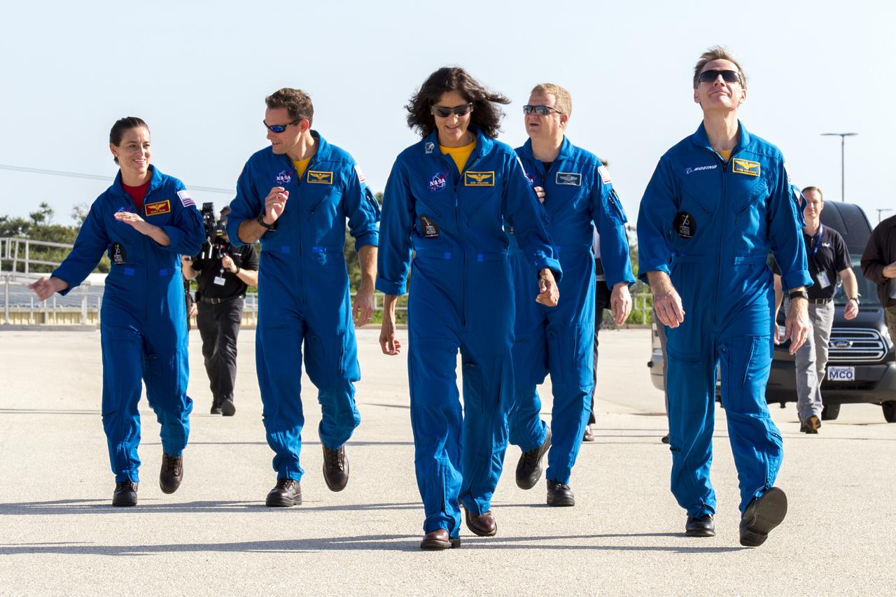 From left, commercial crew astronauts Nicole Mann, Josh Cassada, Suni Williams, Eric Boe and Chris Ferguson visit Kennedy Space Center (KSC) in Florida shortly after they were officially assigned to fly on Boeing’s CST-100 Starliner. The astronauts stopped by Boeing’s Commercial Crew and Cargo Processing Facility (C3PF) at Kennedy and Space Launch Complex 41 at Cape Canaveral Air Force Station to view progress on the Starliner and the launch pad. Boe, Ferguson and Mann will fly on Starliner in an upcoming Crew Flight Test to the International Space Station (ISS). Cassada and Williams are assigned to Boeing’s first operational mission to the ISS. Photo credit: Boeing