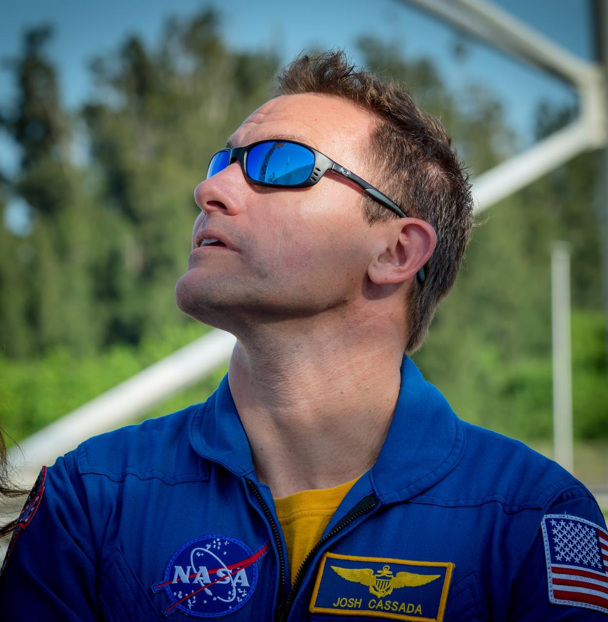 NASA astronaut Josh Cassada takes in the view during an August 2018 visit to Kennedy Space Center (KSC) in Florida. Cassada was joined on the trip by fellow commercial crew astronauts Nicole Mann, Suni Williams, Eric Boe and Chris Ferguson shortly after they were officially assigned to fly on Boeing’s CST-100 Starliner. The astronauts stopped by Boeing’s Commercial Crew and Cargo Processing Facility (C3PF) at KSC and Space Launch Complex 41 at Cape Canaveral Air Force Station to view progress on the Starliner and the launch pad. Boe, Ferguson and Mann will fly on Starliner in Boeing’s upcoming Crew Flight Test to the International Space Station (ISS). Cassada and Williams are assigned to Boeing’s first operational mission to the ISS. Photo credit: Boeing