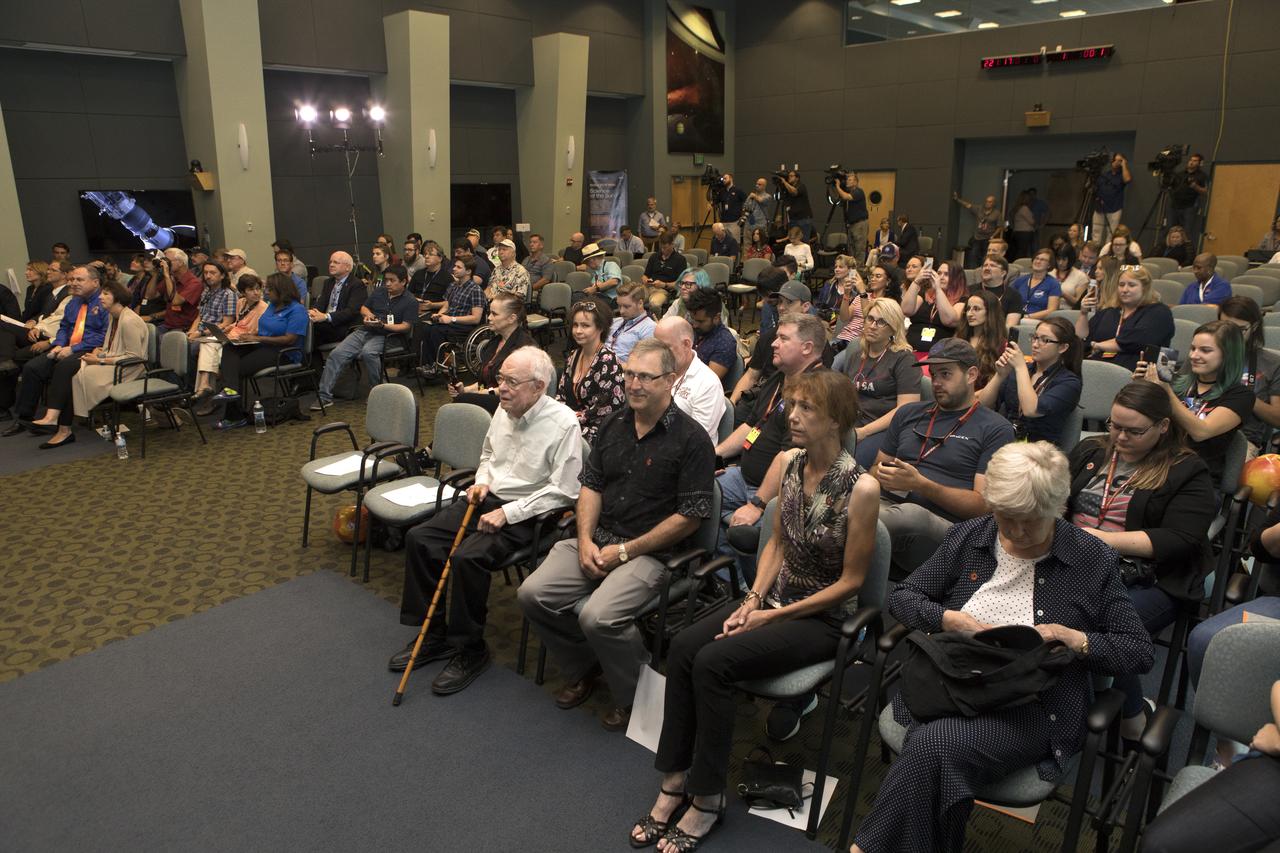 In the Kennedy Space Center's Operations and Support Building II, Thursday, Aug. 9, 2018, members of the media participate in a prelaunch mission briefing on NASA's Parker Solar Probe. Listening to the presentation is Eugene Parker, front row, far left, the S. Chandrasekhar Distinguished Service Professor Emeritus, Department of Astronomy and Astrophysics at the University of Chicago. This is the first NASA mission that has been named for a living individual. The Parker Solar Probe will lift off on a United Launch Alliance Delta IV Heavy rocket from Space Launch Complex 37 at Cape Canaveral Air Force Station in Florida. The spacecraft was built by Applied Physics Laboratory of Johns Hopkins University in Laurel, Maryland. The mission will perform the closest-ever observations of a star when it travels through the Sun's atmosphere, called the corona. The probe will rely on measurements and imaging to revolutionize our understanding of the corona and the Sun-Earth connection.