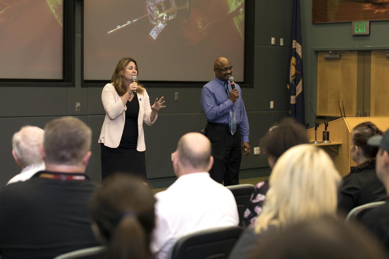 In the Kennedy Space Center's Operations and Support Building II, Thursday, Aug. 9, 2018, members of the media participate in a prelaunch mission briefing on NASA's Parker Solar Probe. Briefing moderators from left, are Karen Fox, Goddard Space Flight Center, and Dwayne Brown, NASA Communications. The Parker Solar Probe will lift off on a United Launch Alliance Delta IV Heavy rocket from Space Launch Complex 37 at Cape Canaveral Air Force Station in Florida. The spacecraft was built by Applied Physics Laboratory of Johns Hopkins University in Laurel, Maryland. The mission will perform the closest-ever observations of a star when it travels through the Sun's atmosphere, called the corona. The probe will rely on measurements and imaging to revolutionize our understanding of the corona and the Sun-Earth connection.