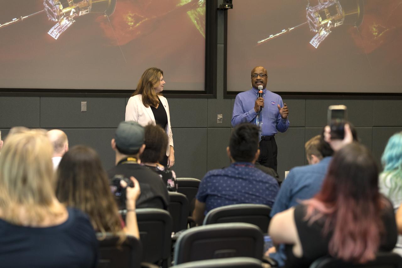 In the Kennedy Space Center's Operations and Support Building II, Thursday, Aug. 9, 2018, members of the media participate in a prelaunch mission briefing on NASA's Parker Solar Probe. Briefing moderators from left, are Karen Fox, Goddard Space Flight Center, and Dwayne Brown, NASA Communications. The Parker Solar Probe will lift off on a United Launch Alliance Delta IV Heavy rocket from Space Launch Complex 37 at Cape Canaveral Air Force Station in Florida. The spacecraft was built by Applied Physics Laboratory of Johns Hopkins University in Laurel, Maryland. The mission will perform the closest-ever observations of a star when it travels through the Sun's atmosphere, called the corona. The probe will rely on measurements and imaging to revolutionize our understanding of the corona and the Sun-Earth connection.