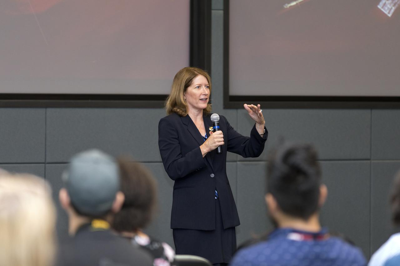 In the Kennedy Space Center's Operations and Support Building II, Thursday, Aug. 9, 2018, members of the media participate in a prelaunch mission briefing on NASA's Parker Solar Probe. Speaking to the media is Kathy Rice, launch weather officer, 45th Weather Squadron, Cape Canaveral Air Force Station. The Parker Solar Probe will lift off on a United Launch Alliance Delta IV Heavy rocket from Space Launch Complex 37 at Cape Canaveral Air Force Station in Florida. The spacecraft was built by Applied Physics Laboratory of Johns Hopkins University in Laurel, Maryland. The mission will perform the closest-ever observations of a star when it travels through the Sun's atmosphere, called the corona. The probe will rely on measurements and imaging to revolutionize our understanding of the corona and the Sun-Earth connection.