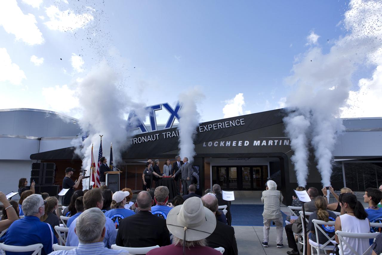 Guests cheer the opening of the new Astronaut Training Experience (ATX) at the Kennedy Space Center Visitor Complex. The ATX uses three-dimensional computer display simulation technology to "transport" participants to Mars, training them to live and work in the environment of the Red Planet. The educational experience also teaches what it’s like to travel there. The facility uses NASA science to address engineering challenges in space travel. Lockheed Martin is the title sponsor for the Astronaut Training Experience.