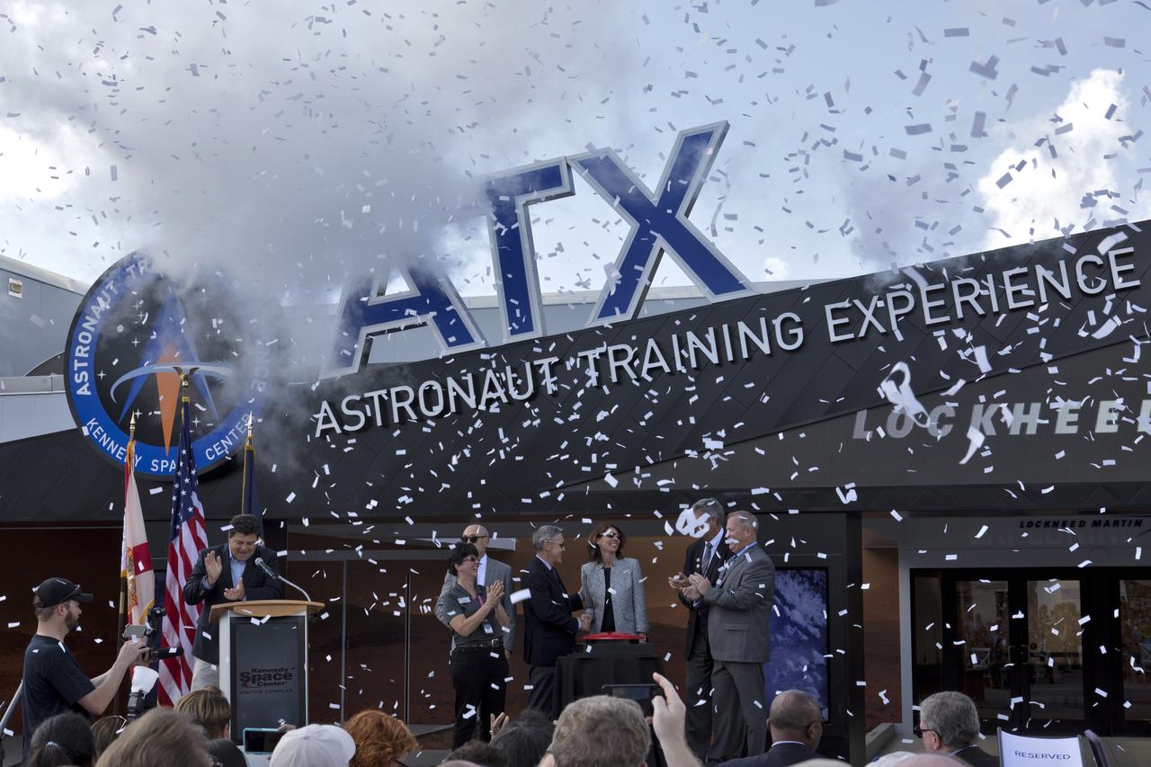 Confetti flies during the opening ceremony for the new Astronaut Training Experience (ATX) at the Kennedy Space Center Visitor Complex. The ATX uses three-dimensional computer display simulation technology to "transport" participants to Mars, training them to live and work in the environment of the Red Planet. The educational experience also teaches what it’s like to travel there. The facility uses NASA science to address engineering challenges in space travel. Lockheed Martin is the title sponsor for the Astronaut Training Experience.
