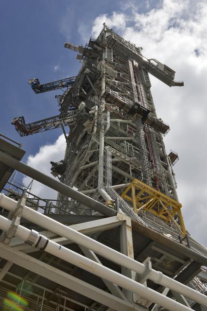 A swing test of the Orion crew access arm, top right, is in progress on the m...