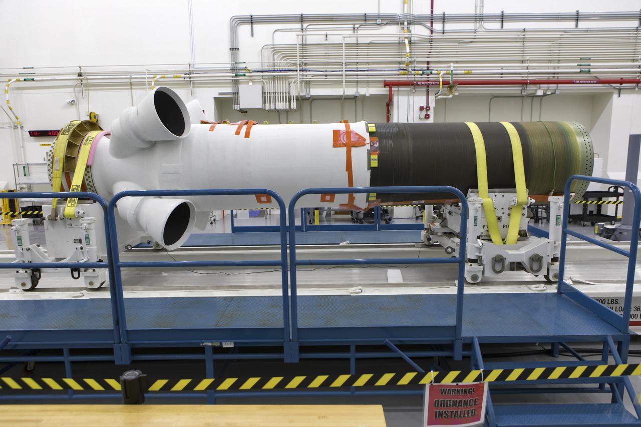 The abort motor for Orion's Launch Abort System (LAS) is secured on a work stand inside the Launch Abort System Facility on Aug. 28, 2018, at NASA's Kennedy Space Center in Florida. This motor will be used for flight during a full-stress test of the LAS, called Ascent Abort-2 (AA-2) flight test, scheduled for April 2019. The abort motor is what will activate to pull the Orion crew module away during the event of an emergency during ascent. AA-2 will launch from Space Launch Complex 46, carrying a fully functional LAS and a 22,000-pound Orion test vehicle to an altitude of 31,000 feet and traveling at more than 1,000 miles an hour. The test will verify the LAS can steer the crew module and astronauts aboard to safety in the event of an issue with the Space Launch System (SLS) rocket when the spacecraft is under the highest aerodynamic loads it will experience during a rapid climb into space. NASA's Orion and Exploration Ground Systems programs and contractors from Jacob's and Northrup Grumman in conjunction with the Air Force Space and Missile Center's Launch Operations branch are performing flight operations for AA-2.